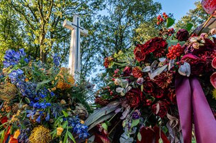 Arnhem Oosterbeek Cemetery Cross of Sacrifice surrounded by wreaths two weeks after the 80th anniversary commemorations of Op. MARKET GARDEN. 