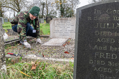 Tidying up the grave of AC2 Noel John Danby.