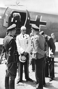 Oberstleutnant Walter Koch arriving back in Berlin with his head injury, shortly before his death 'from injuries sustained in a car accident'.