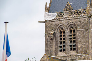 The famous model recreating the US Paratrooper who got caught on the church tower at Ste Mare Eglise on D-Day