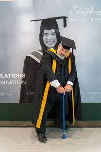 In the robes of a Master of Arts, Falmouth University