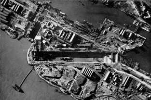 Areial reconnaissance photo of St Nazaire dock showing the wreckage of HMS Campbeltown still in the dry dock.